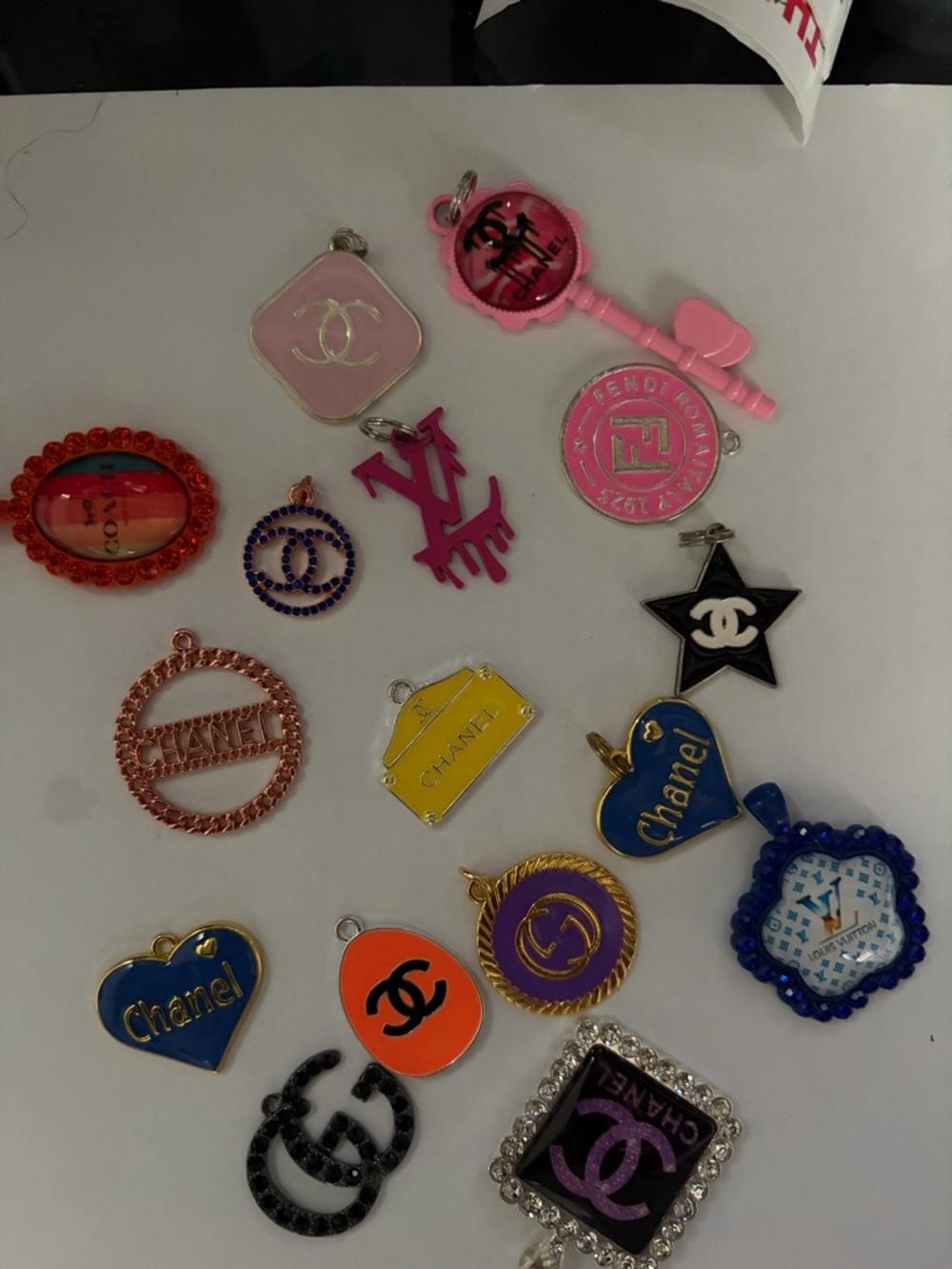 CHANEL Pink and Blue Assorted Logo Charms Collection